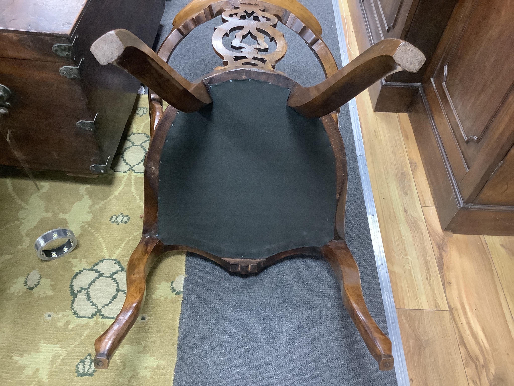 A Victorian carved walnut elbow chair, width 58cm, depth 48cm, height 90cm